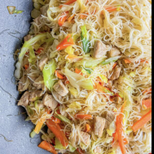 dish of rice noodle stir fry with chicken and vegetables